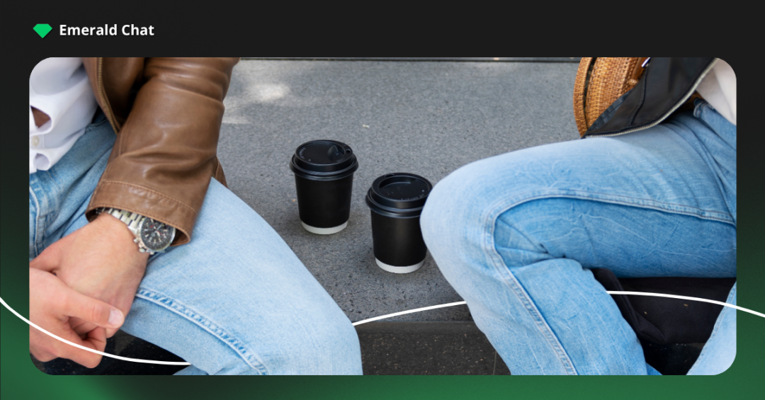 Two people sitting with coffee placed between them, showing emotional distance and the quiet shift of outgrowing friendships quietly over time.