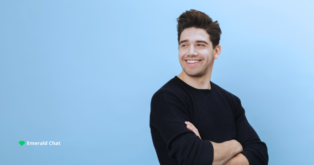 a man in black shirt and smiling
